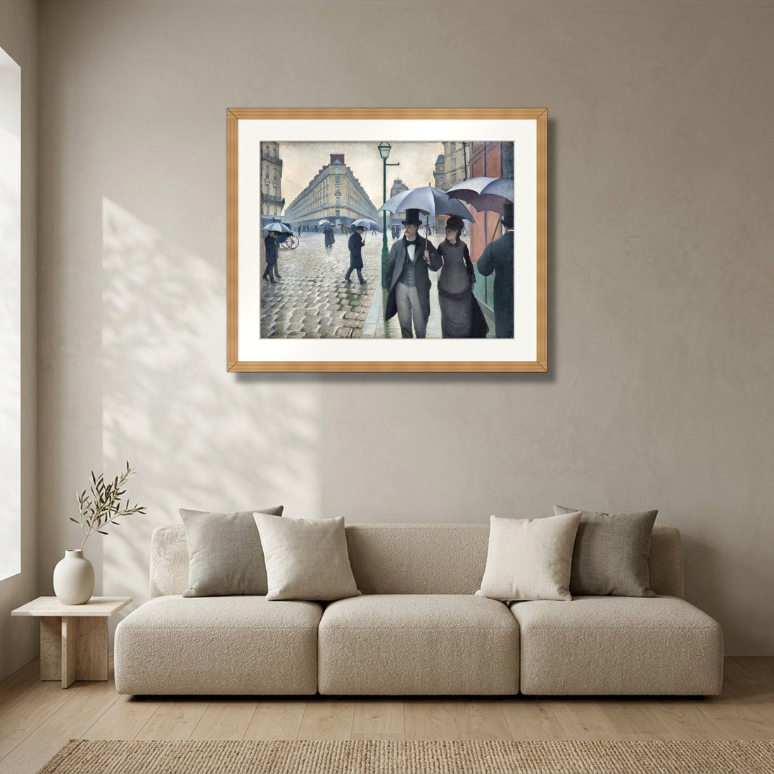 Paris Street; Rainy Day (1877) – Gustave Caillebotte framed in solid natural oak in a modern living room