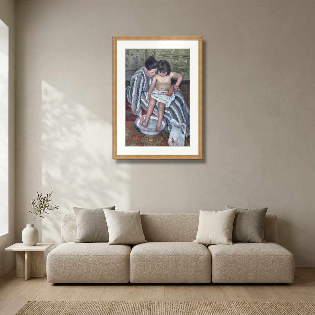The Child's Bath (1893) – Mary Cassatt framed in solid natural oak in a modern living room