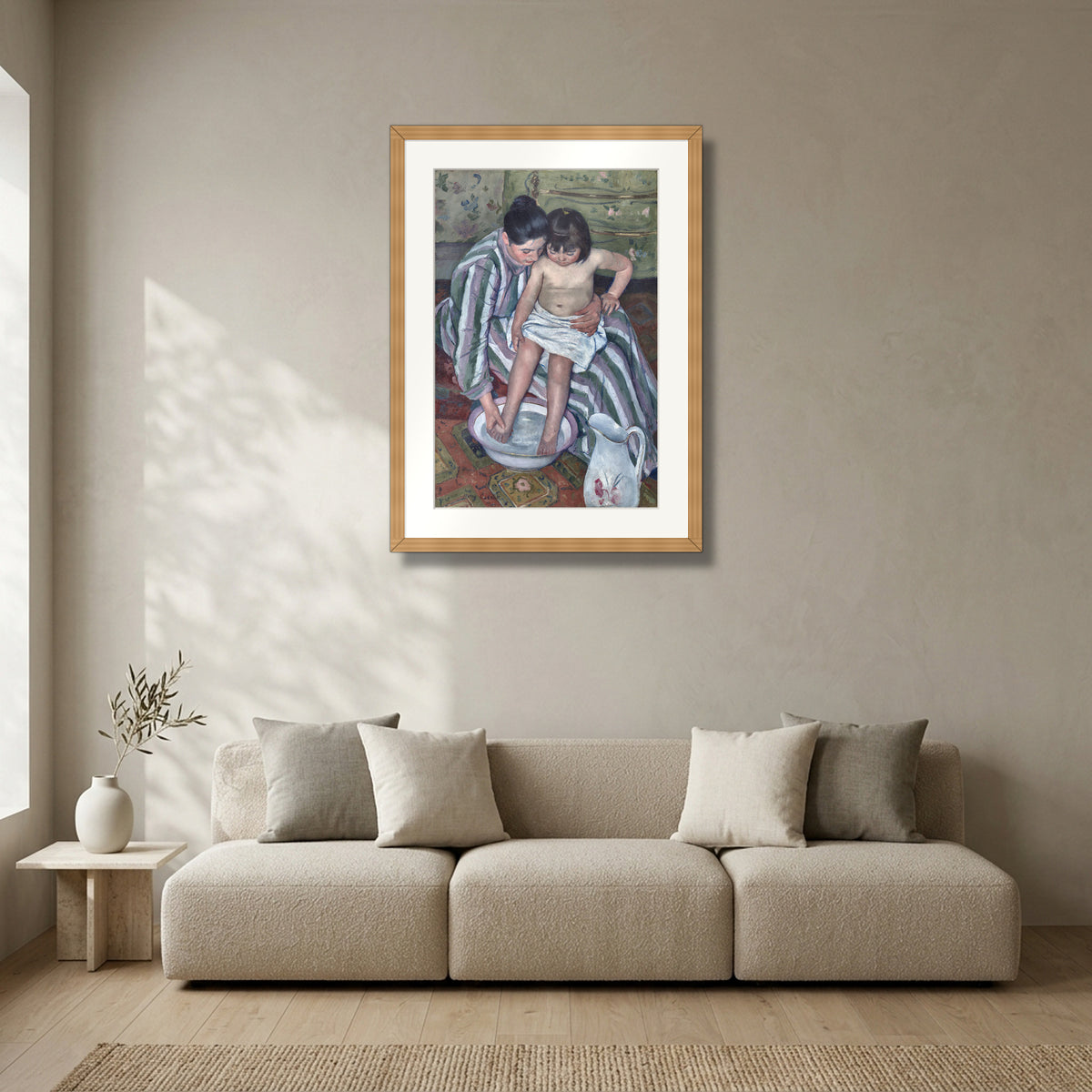 The Child's Bath (1893) – Mary Cassatt framed in solid natural oak in a modern living room