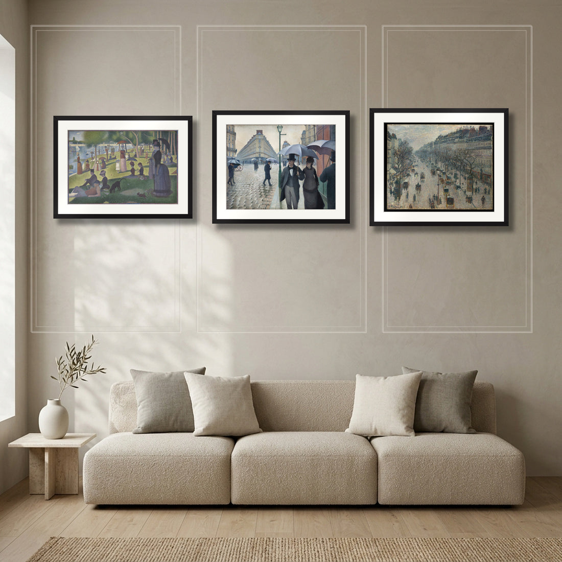 Paris Promenade Triptych – La Grande Jatte by Seurat, Paris Street; Rainy Day by Caillebotte and Boulevard Montmartre by Pissarro, three framed prints in a Parisian salon